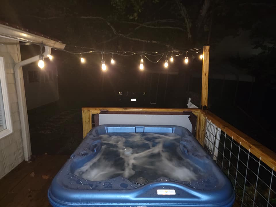 image Relax in the lovely outdoor hot tub.
