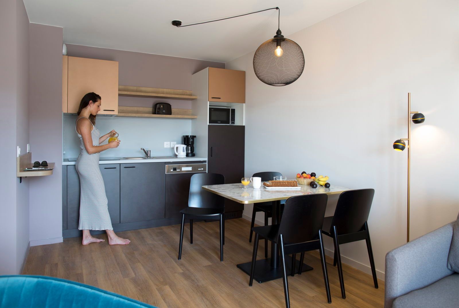 image Kitchenette with a toaster, kettle, and coffee maker on the counter — everything within reach for a quick meal