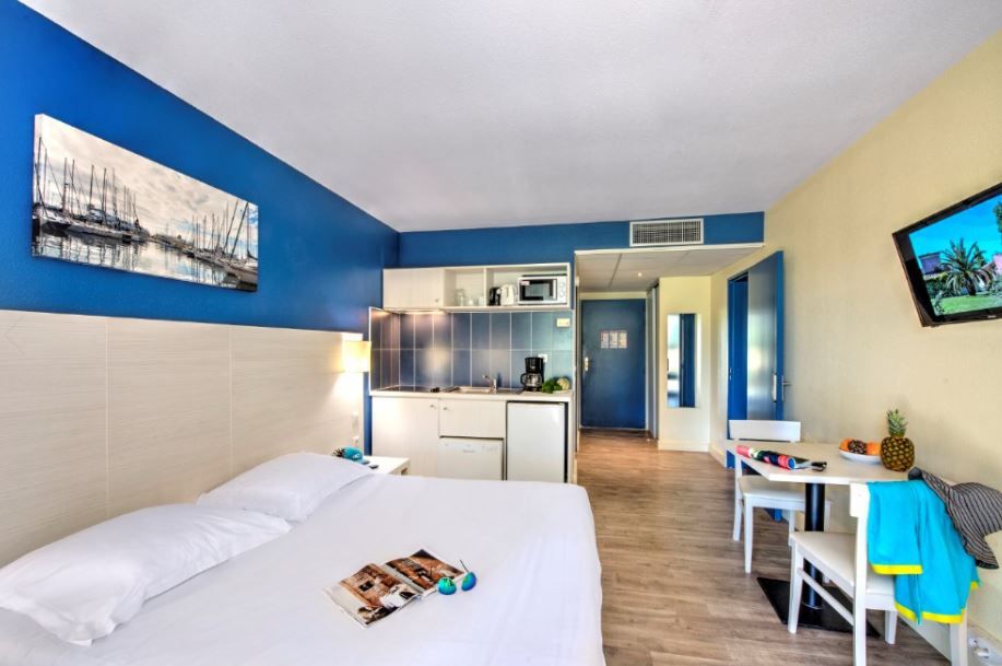 image Relax on the comfy bed after a day outside. Bedding configurations vary.