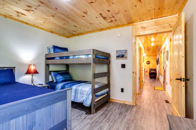 The second bedroom features 1 Queen bed and 1 Bunk bed.