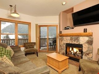 image Kick up your feet and relax in the spacious living area after a day on the slopes.