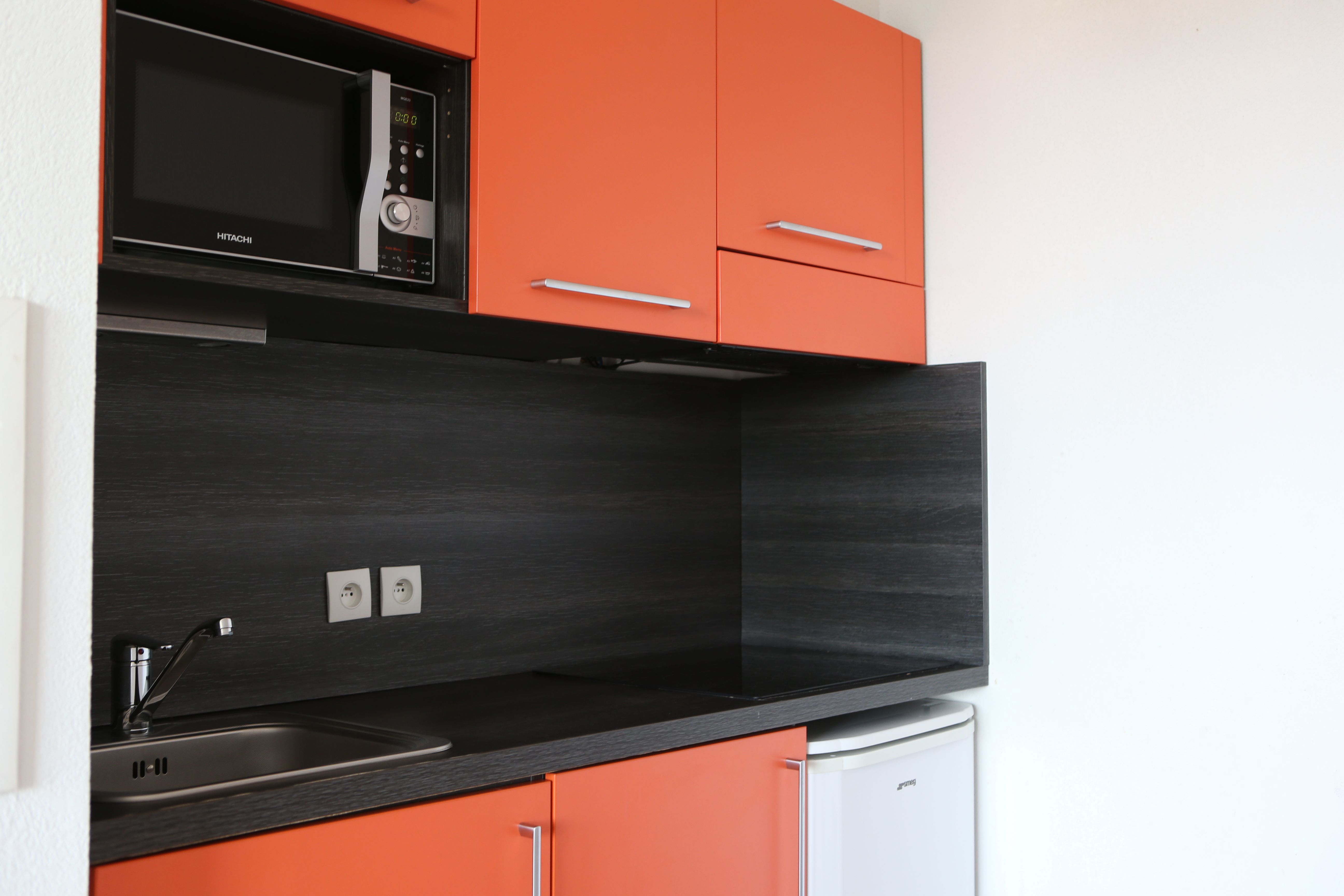 image Prepare a meal in the equipped kitchen.