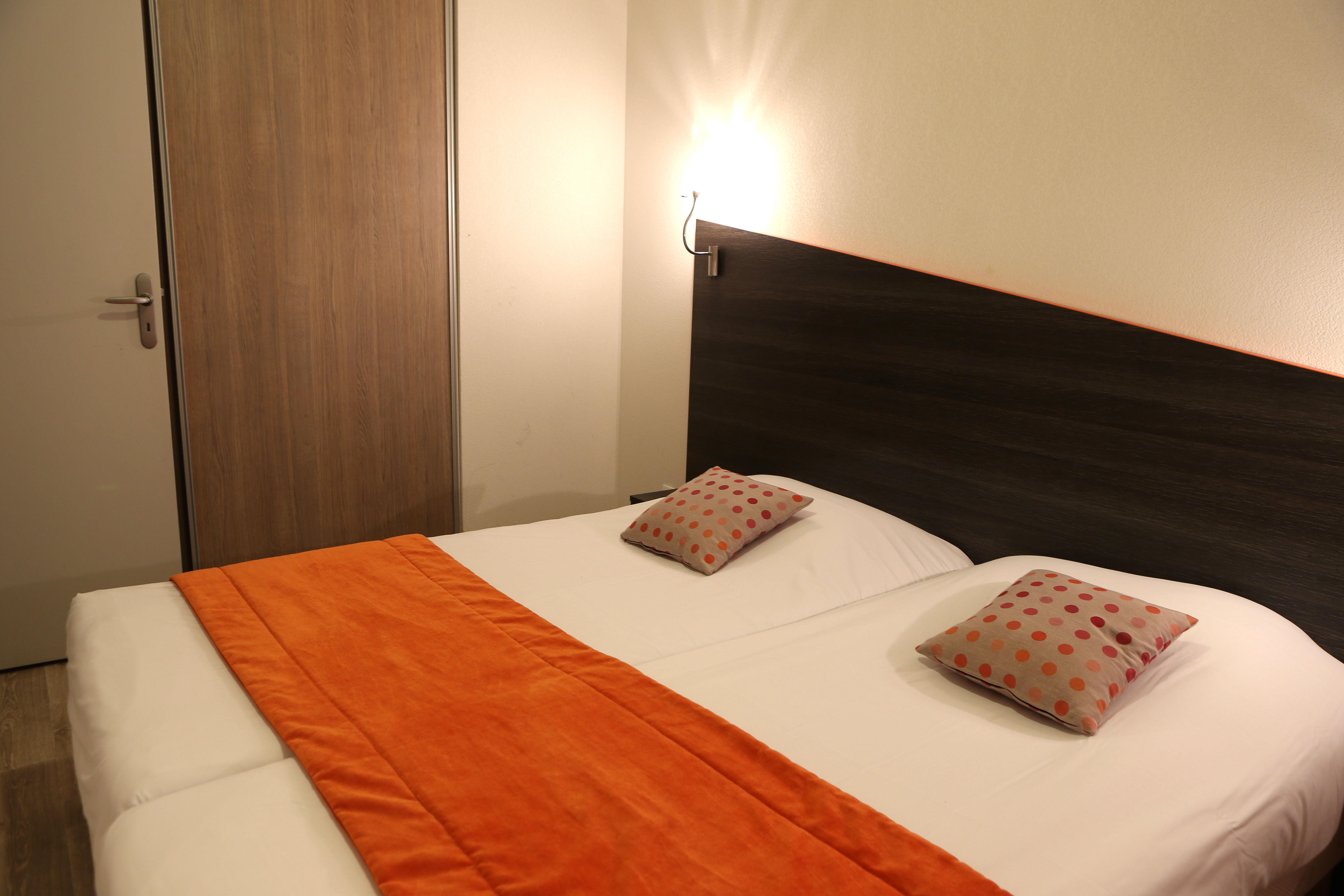image Drift to sleep in a comfortable bed after a wonderful day outside.