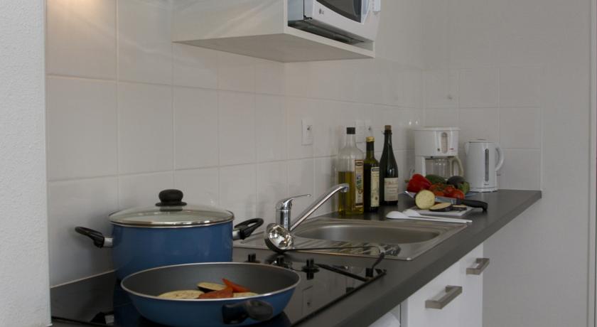 image Whip up a quick bite to eat in the kitchen.