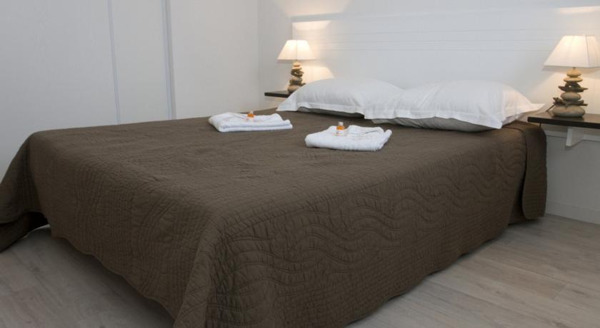image Drift to sleep in a comfortable bed after a wonderful day outside.