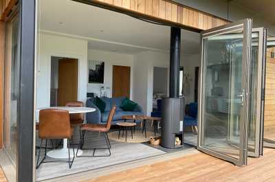 Our lodge features floor-to-ceiling bi-fold doors that open up onto the expansive terrace.