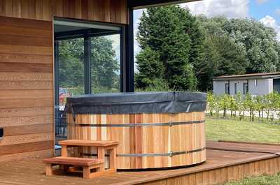 Take a soak in our Cedar Barrel hot tub.