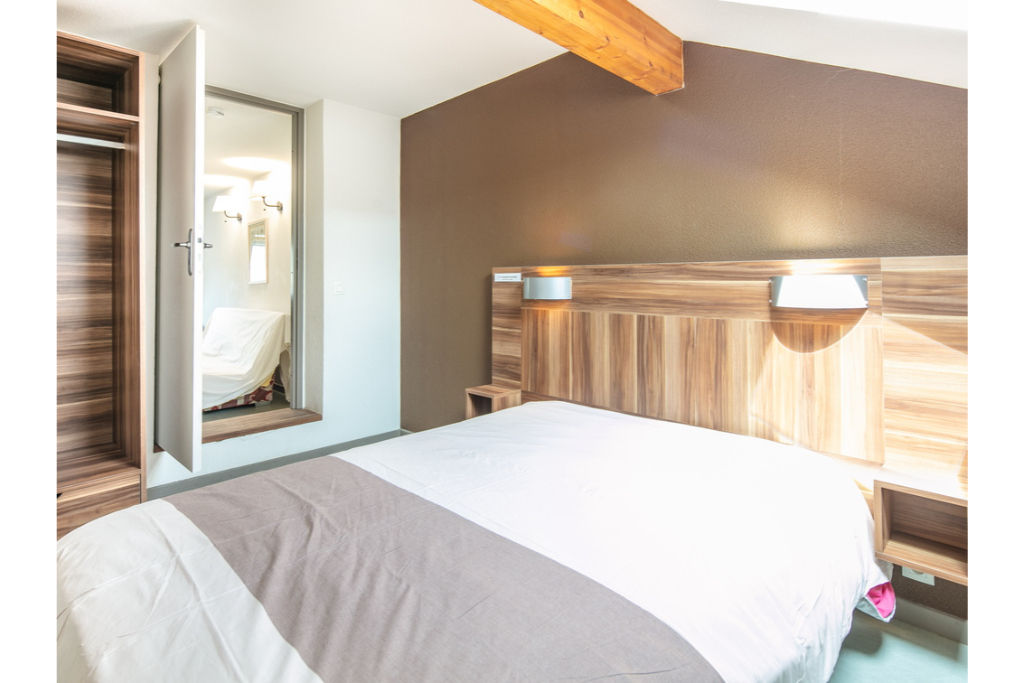 image Drift to sleep in a comfortable bed after a wonderful day outside.