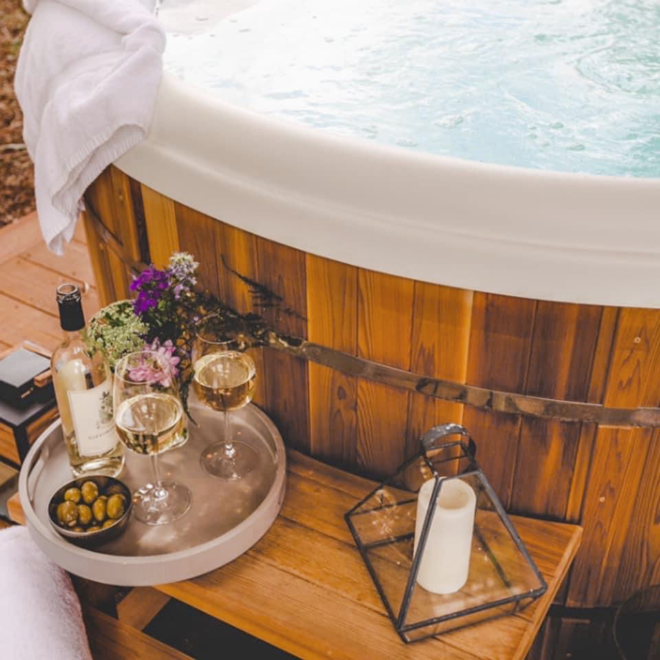 image Relax in the hot tub with a snack or glass of wine.