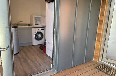 The utility room is accessible from a separate door.