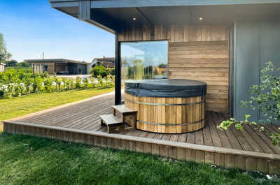 The private outdoor hot tub is perfect for relaxing.