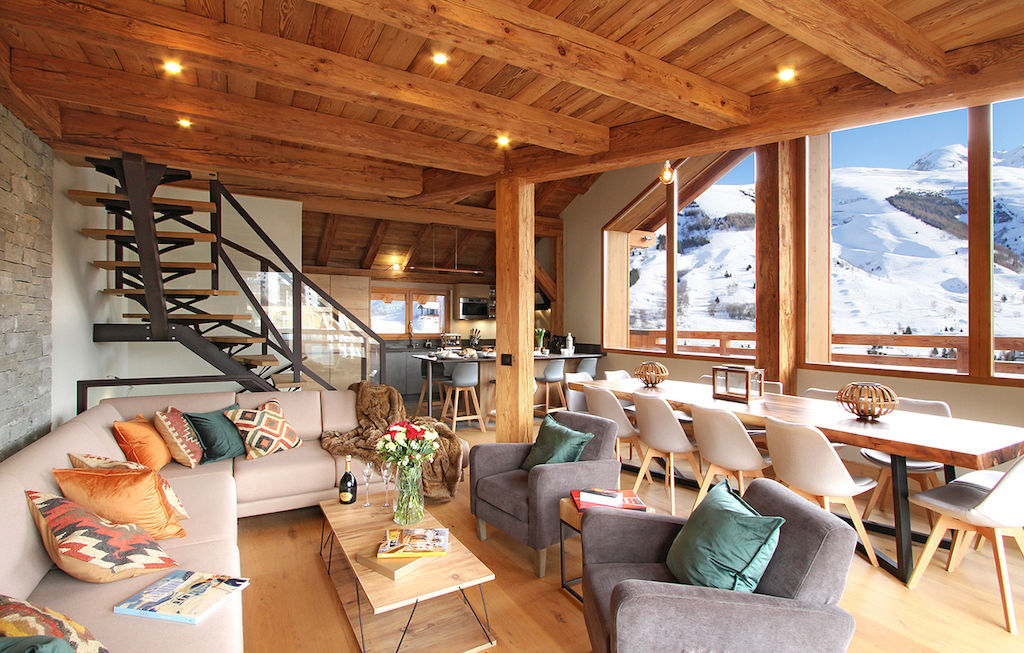 image Relax in the bright living area with a large sectional sofa.