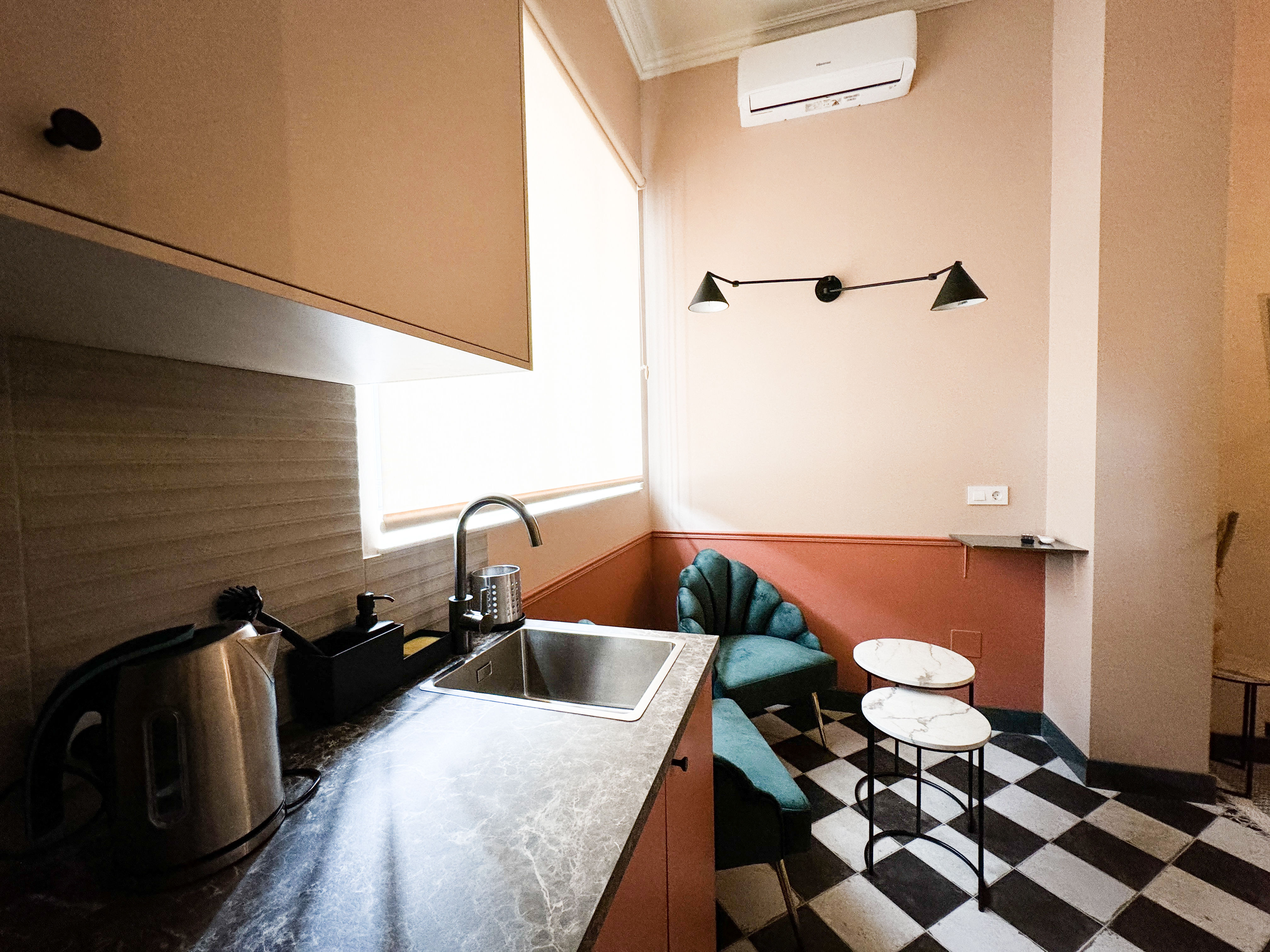 image Cozy kitchenette with modern appliances, perfect for preparing a quick meal before heading out to explore Málaga.