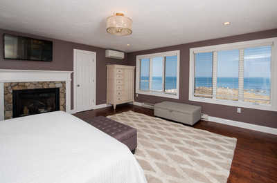 You'll love the fireplace and flat-screen TV in the master bedroom!