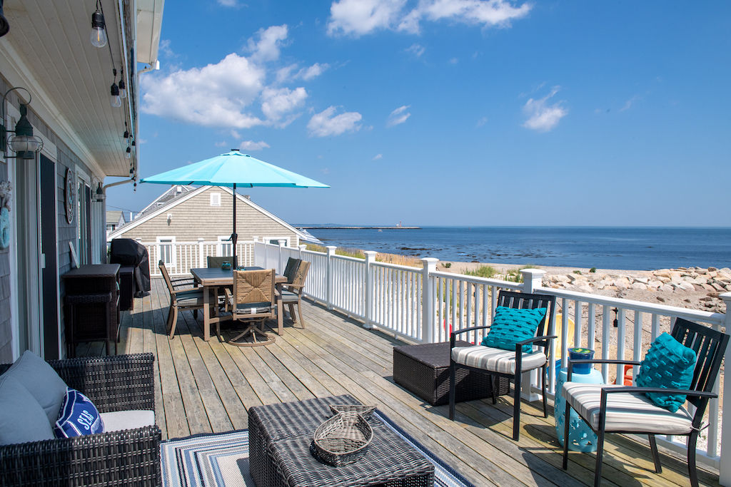 image The wrap-around deck is perfect for relaxing to the sound of the waves and watching the beautiful ocean.