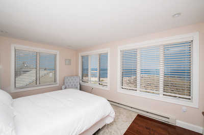 The secondary bedroom upstairs features 1 Queen bed.