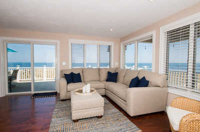 Kick back your feet and relax in the cozy living area with beautiful ocean views!