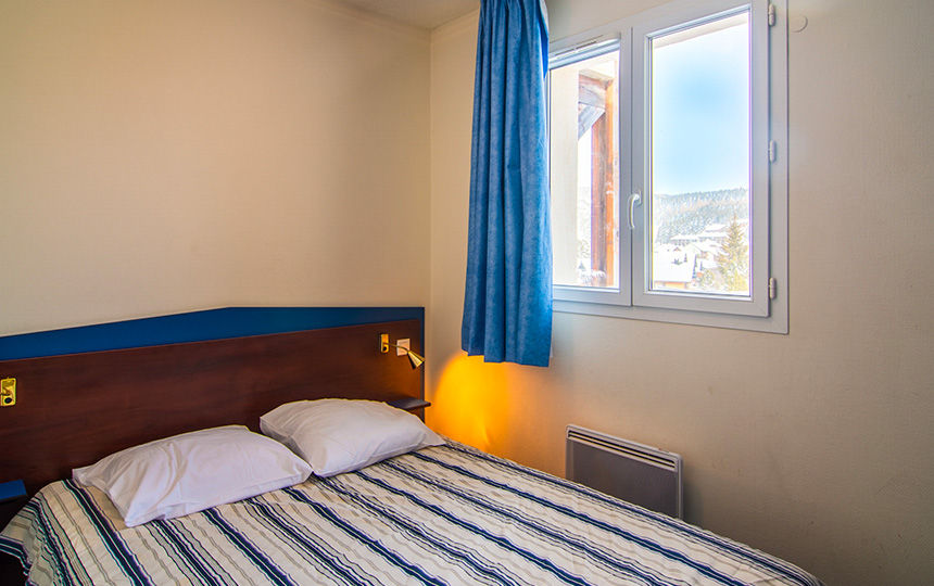 image Wake up to mountain views from the bedroom before heading out to the pistes.