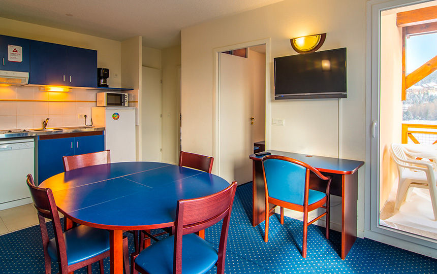image Dinner stays easy with a hob, microwave and fridge in the kitchenette and the balcony door a step away.