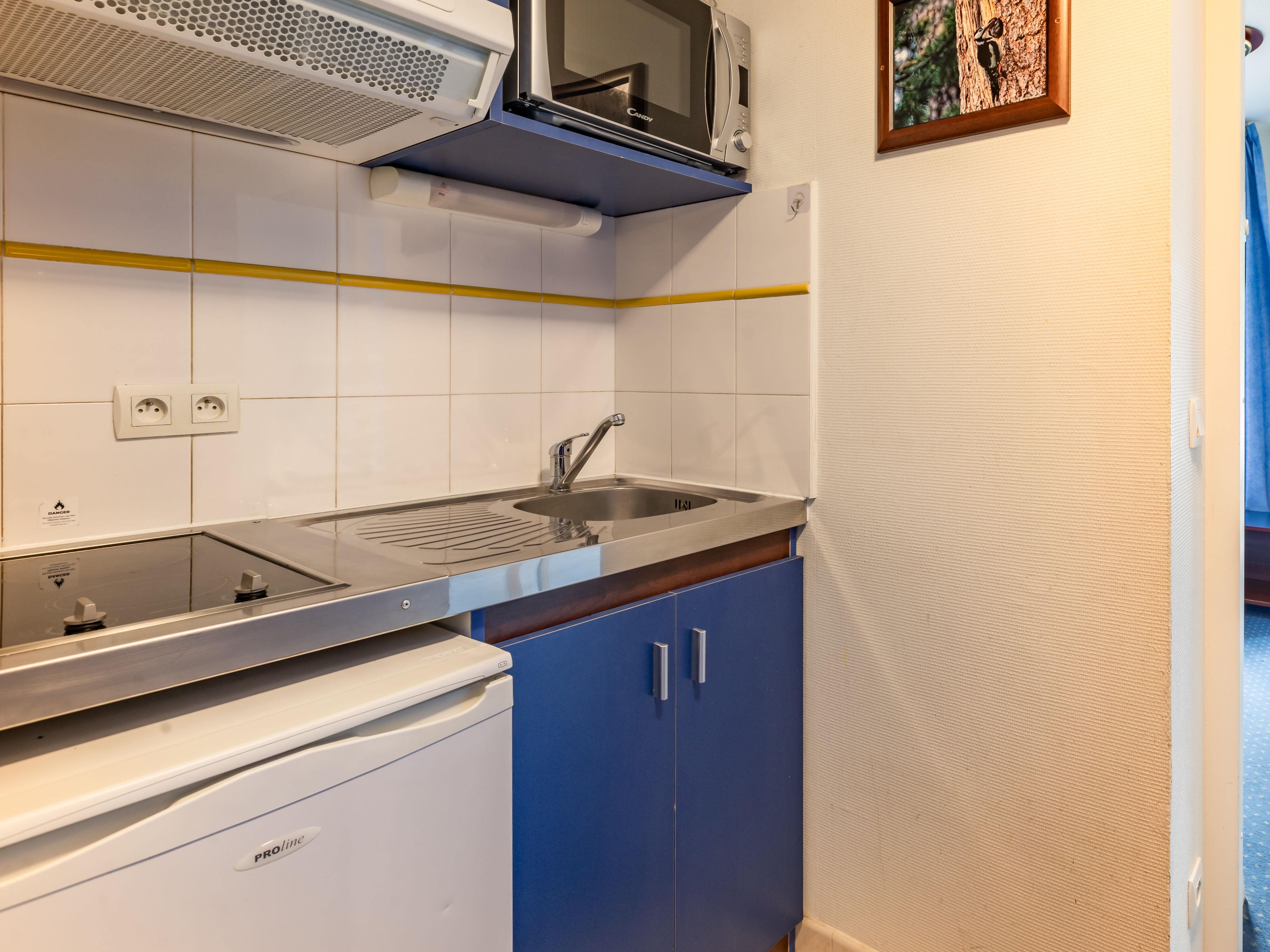 image Quick meals come together in the kitchenette, with a hob, microwave and fridge to hand.