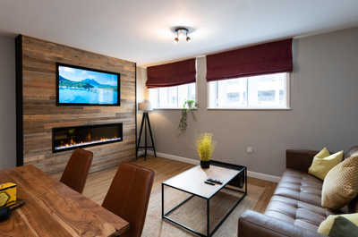 Feature wall with smart 50" TV and 60" fireplace