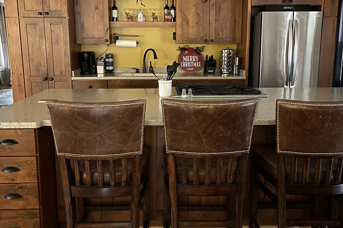 image Treat yourself to a snack courtesy of our kitchen island.