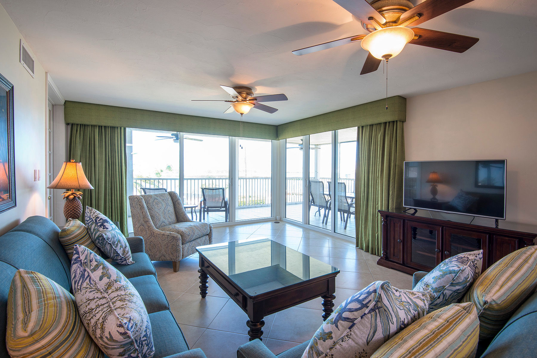 image The open living room area features cable TV. 