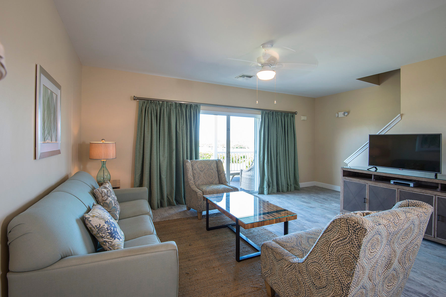 image The open living room area features cable TV.