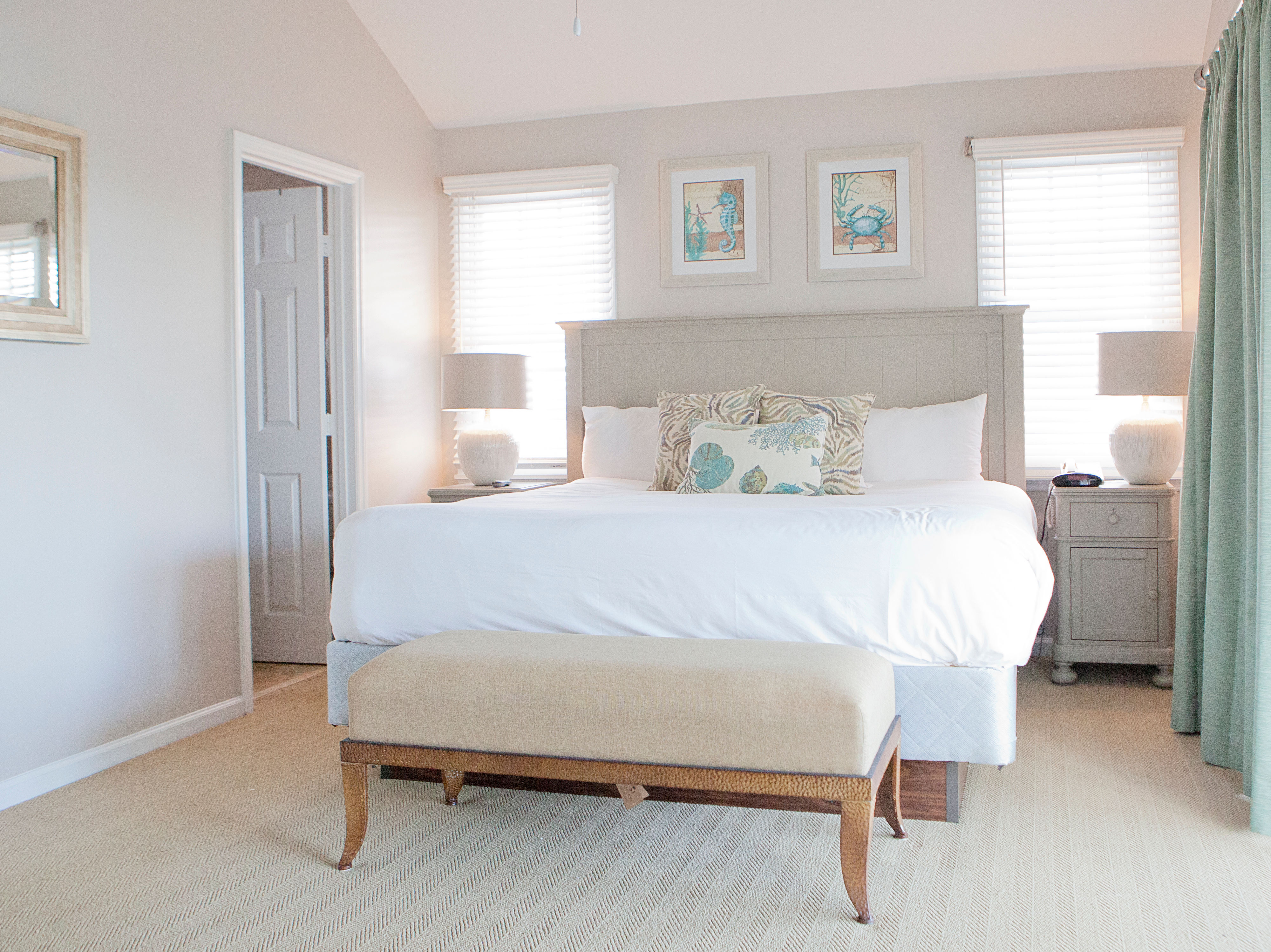 image The master bedroom features a queen bed.