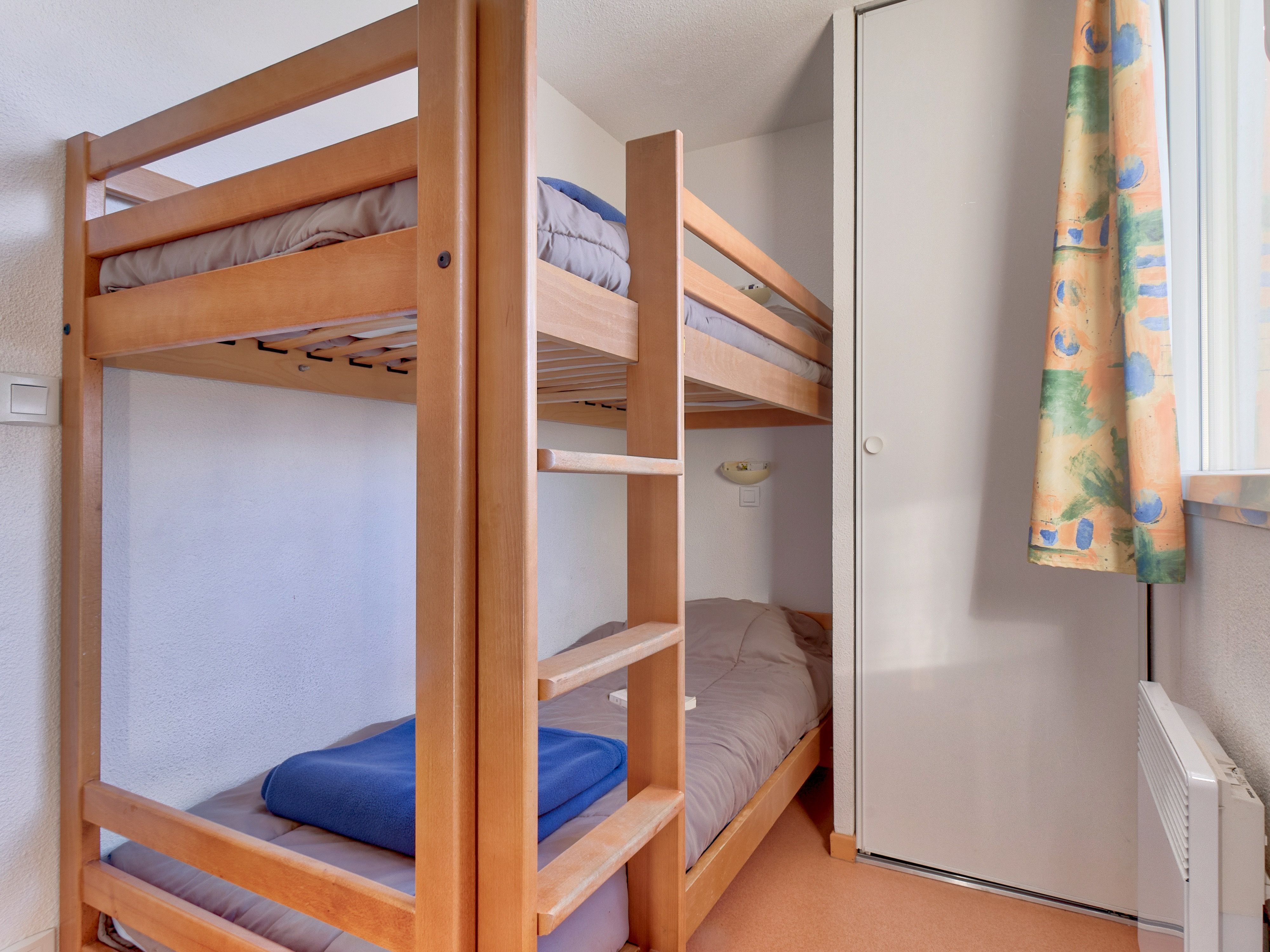 image Compact yet comfortable bunk bedroom, perfect for friends on an adventure.