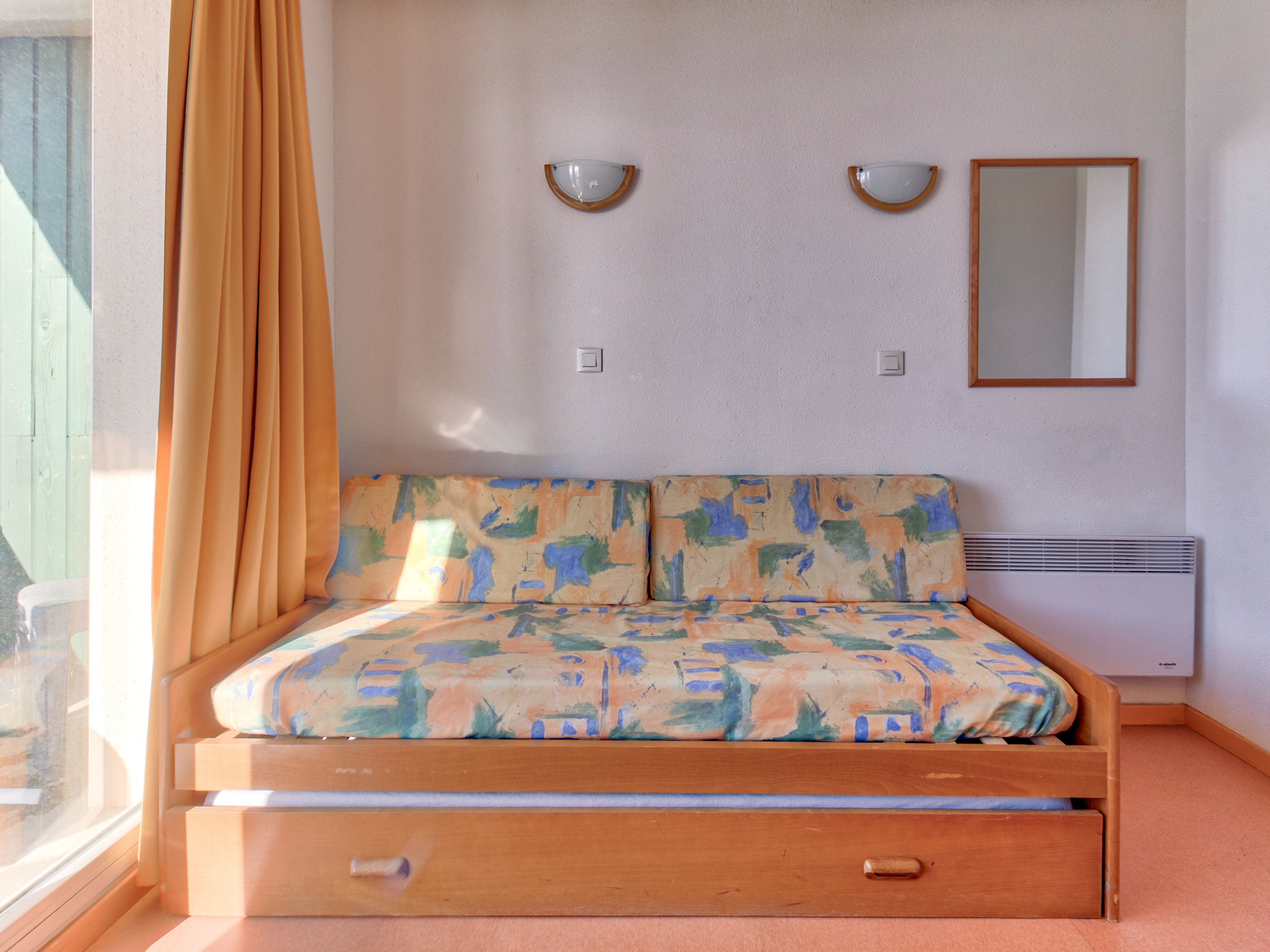 image The convertible sofa bed sleeps up to 2 people.
