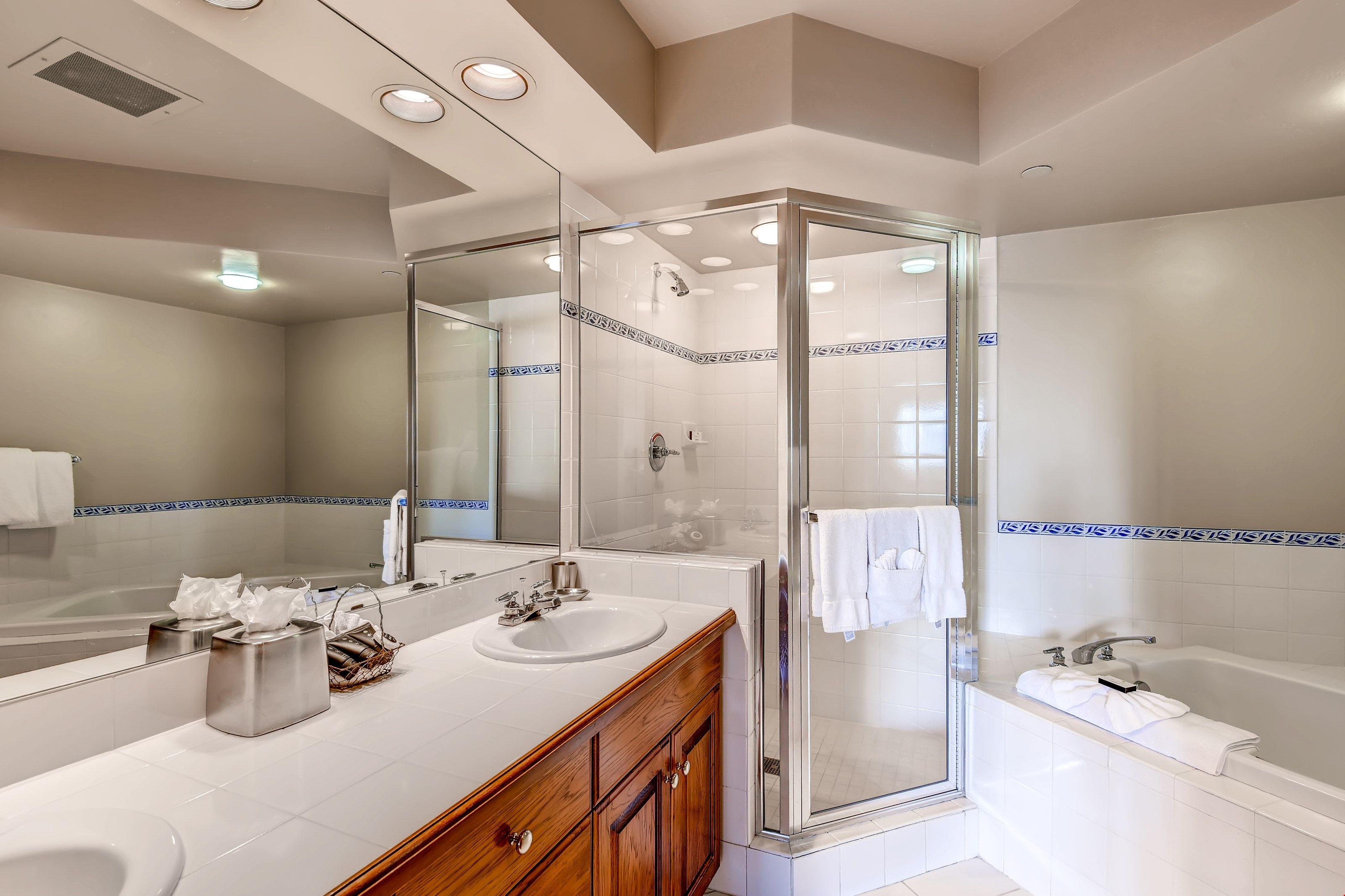 image The 2 Bedroom Condo features an oversized bathrooms with a spa tub and shower.