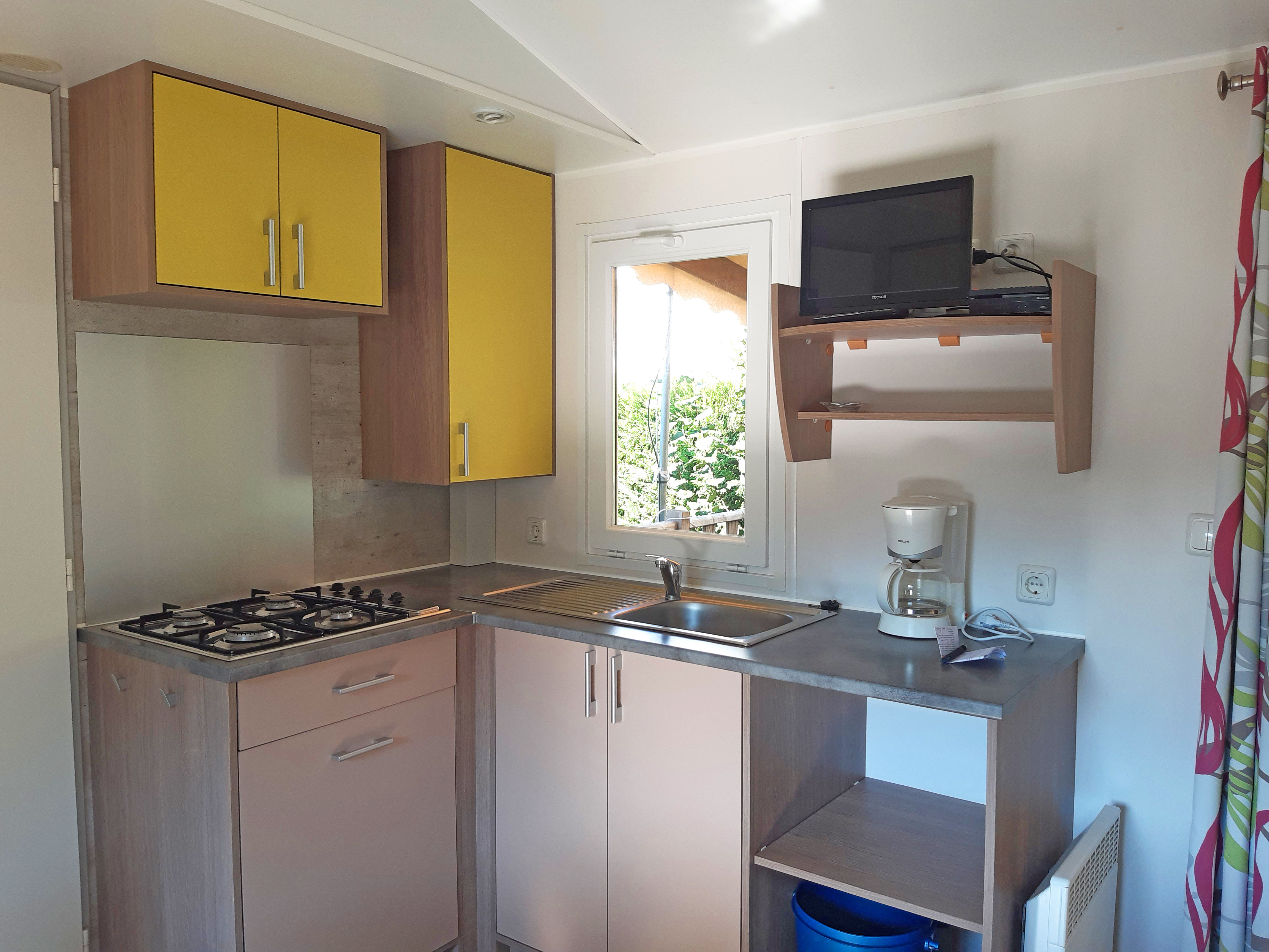 image Compact kitchen with everything you need for easy meal prep during your stay.