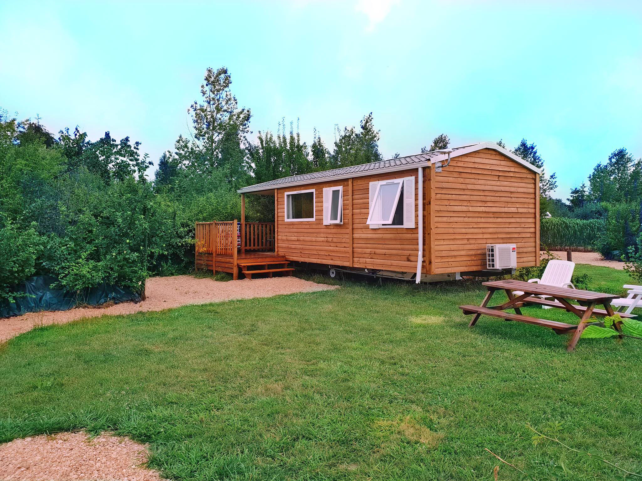 image Your private mobile home retreat amidst lush greenery