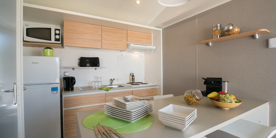 image Enjoy the perfect home-cooked meal in our modern and functional kitchenette.