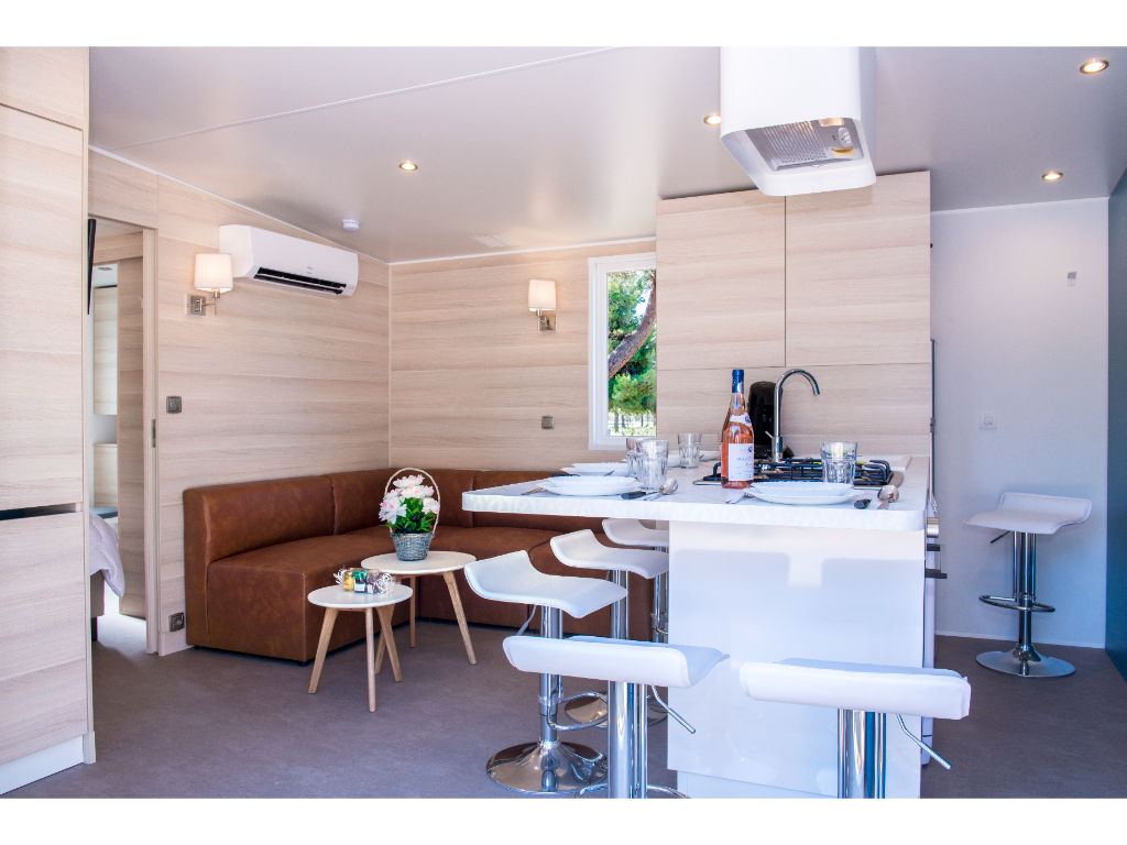image Spacious and bright living area with a cozy seating arrangement, ideal for family gatherings.