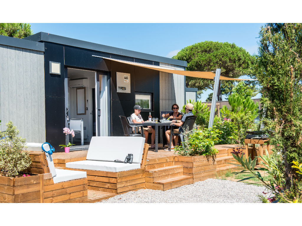 image Modern camping home with a stylish deck, perfect for lounging and enjoying the outdoors.