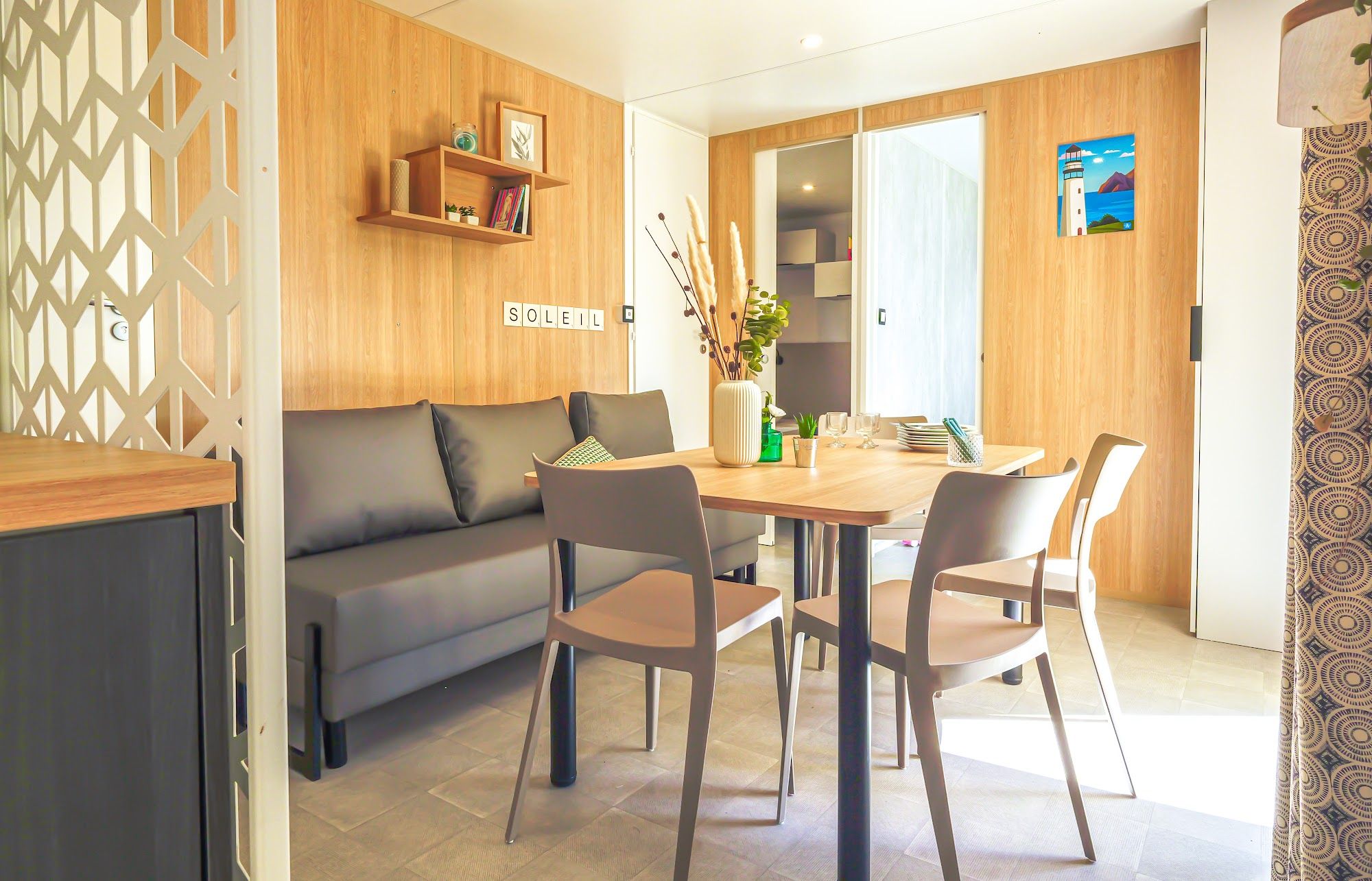 image Dining area featuring a table set for meals in a wooden interior.