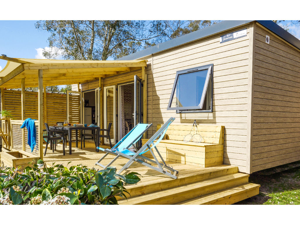 image Relax on the sunny deck, complete with comfortable seating and a peaceful atmosphere.