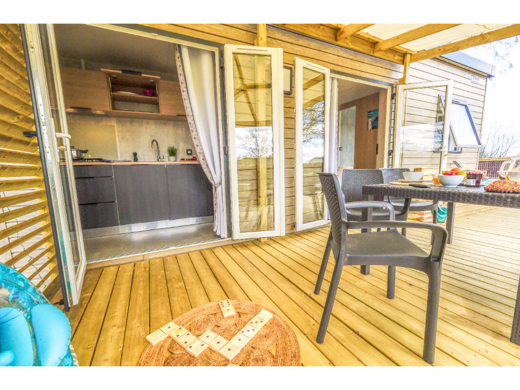 image A charming covered patio, perfect for outdoor dining and unwinding in style.