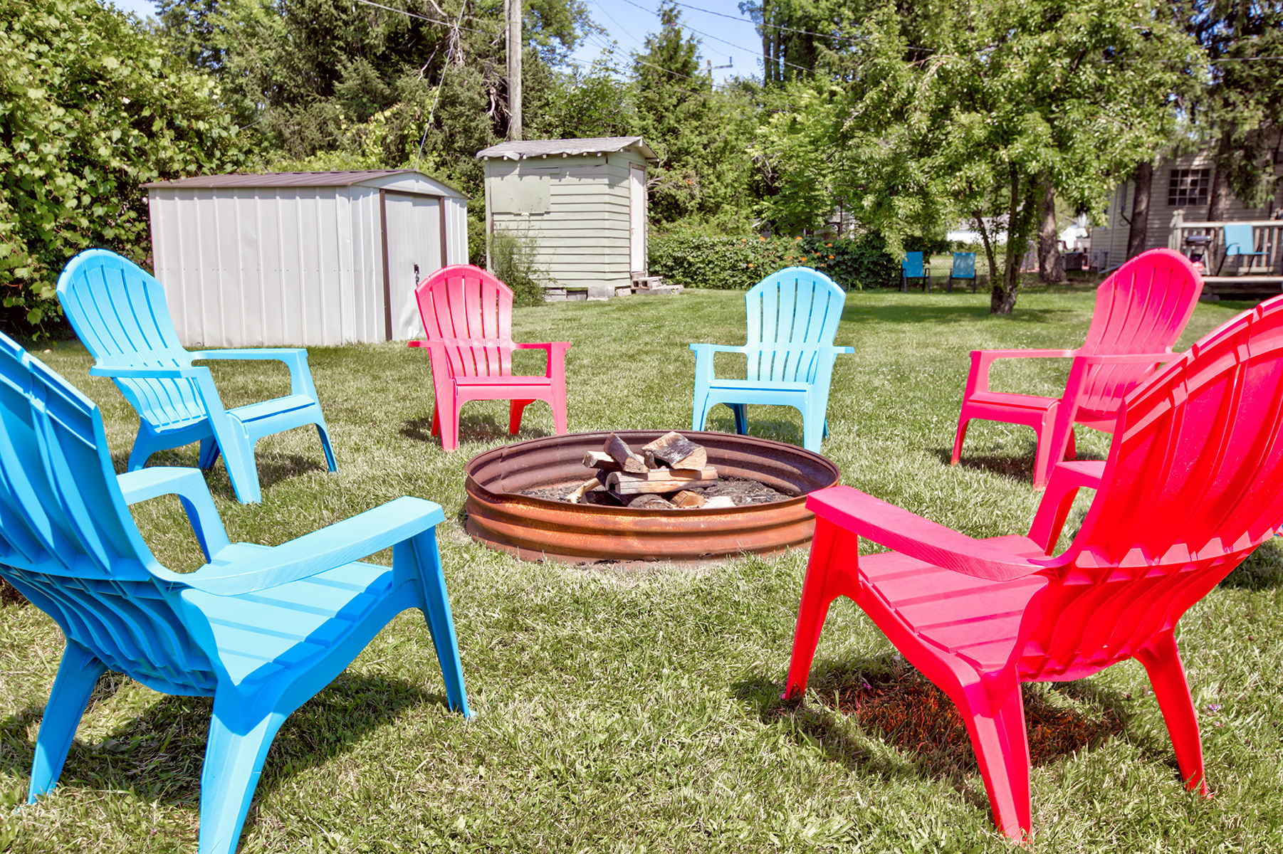 image Vibrant chairs invite you to enjoy the garden.