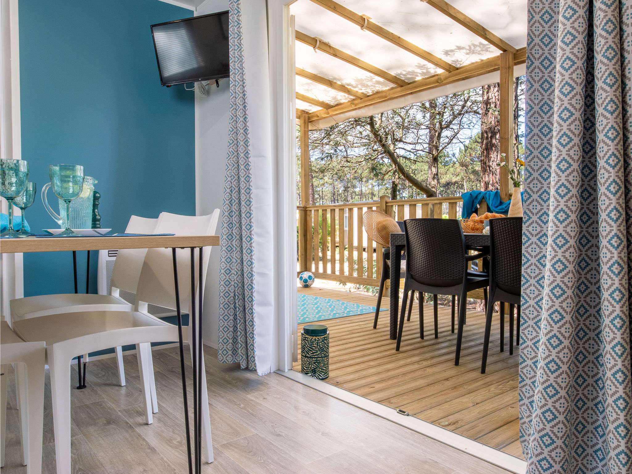 image Inviting indoor-outdoor transition space, providing a comfortable spot to relax and dine.