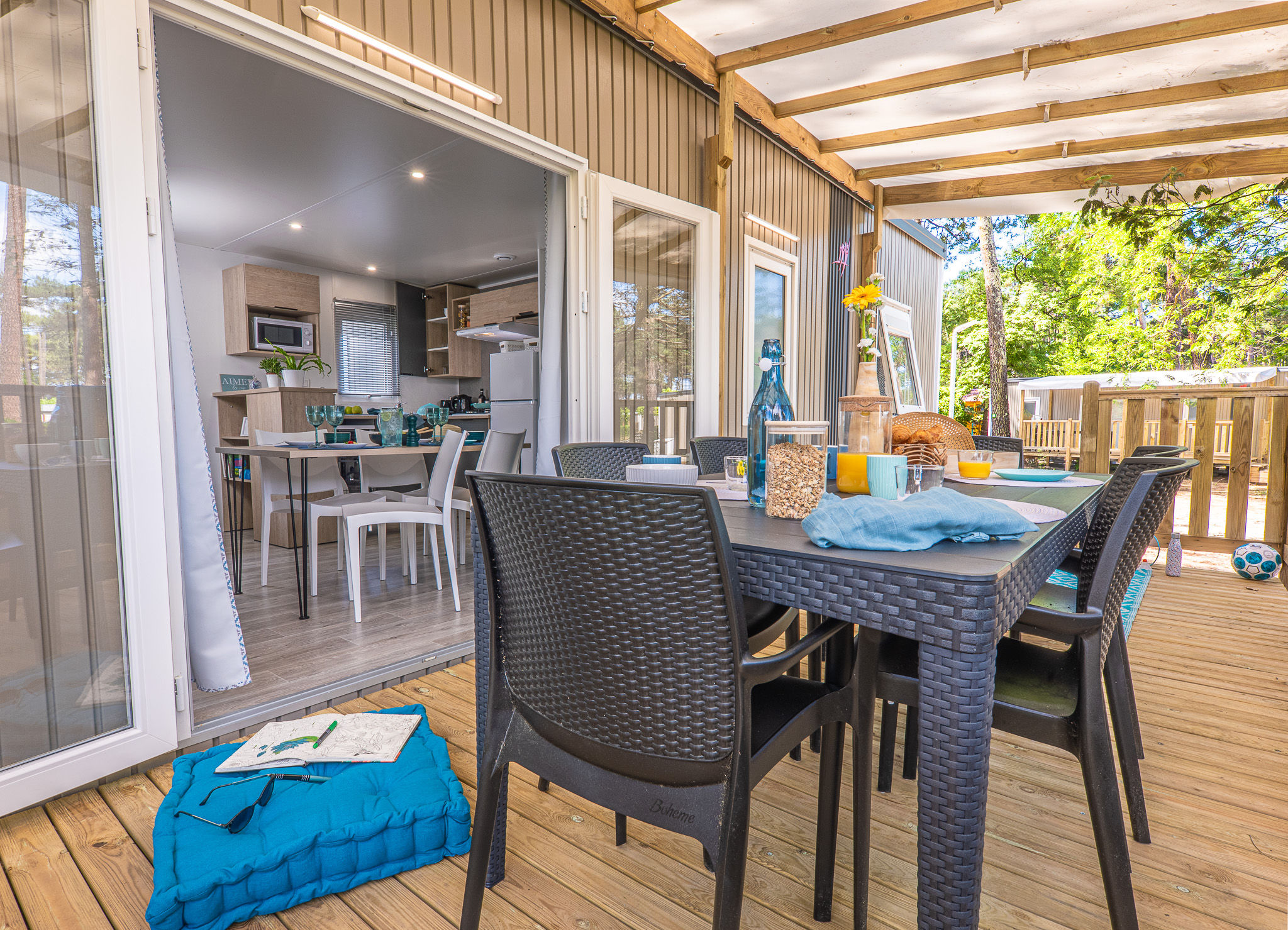 image Covered outdoor dining space with cozy seating, perfect for enjoying meals in fresh air.