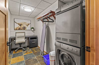 The laundry room in the hallway also a desk.