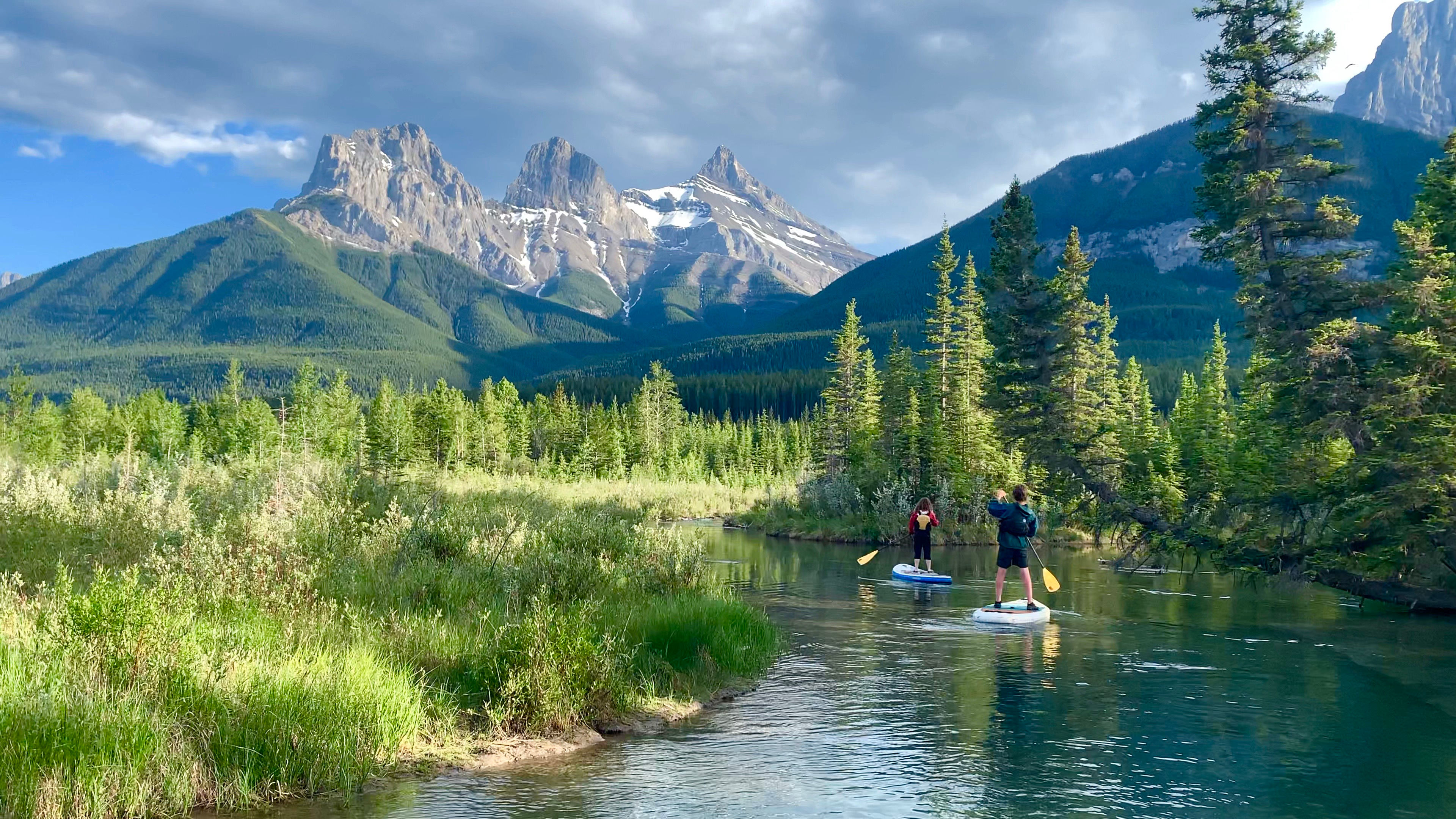 image  Glide across Canmore's crystal-clear waters with the stunning Rockies towering in the distance—pure bliss on a paddleboard.