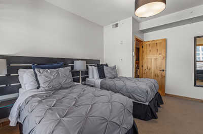 The third bedroom features two twin beds that can be turned into one king bed.