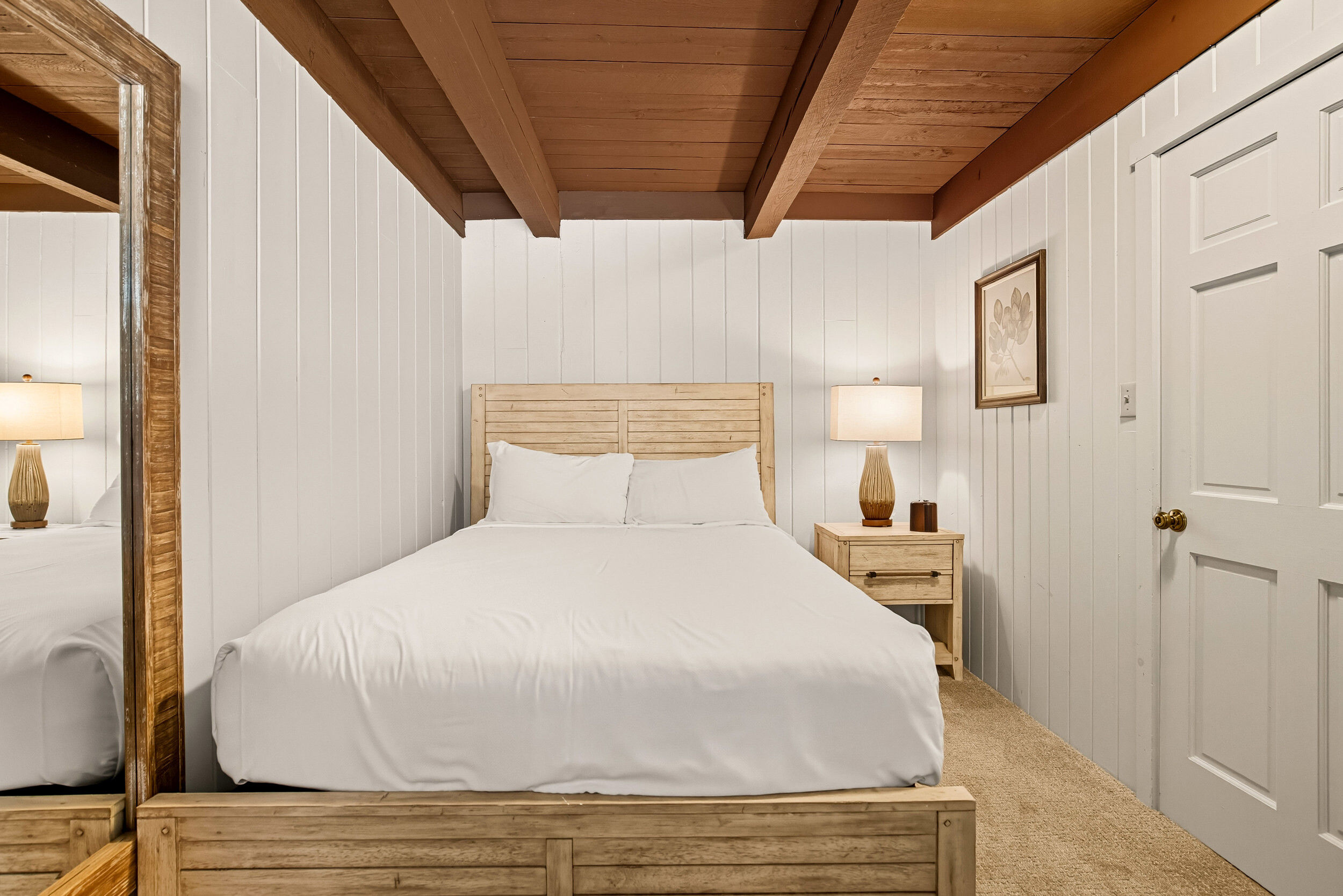 image A serene bedroom with a warm ambiance invites families to unwind, featuring charming decor and a comfortable bed for restful nights.