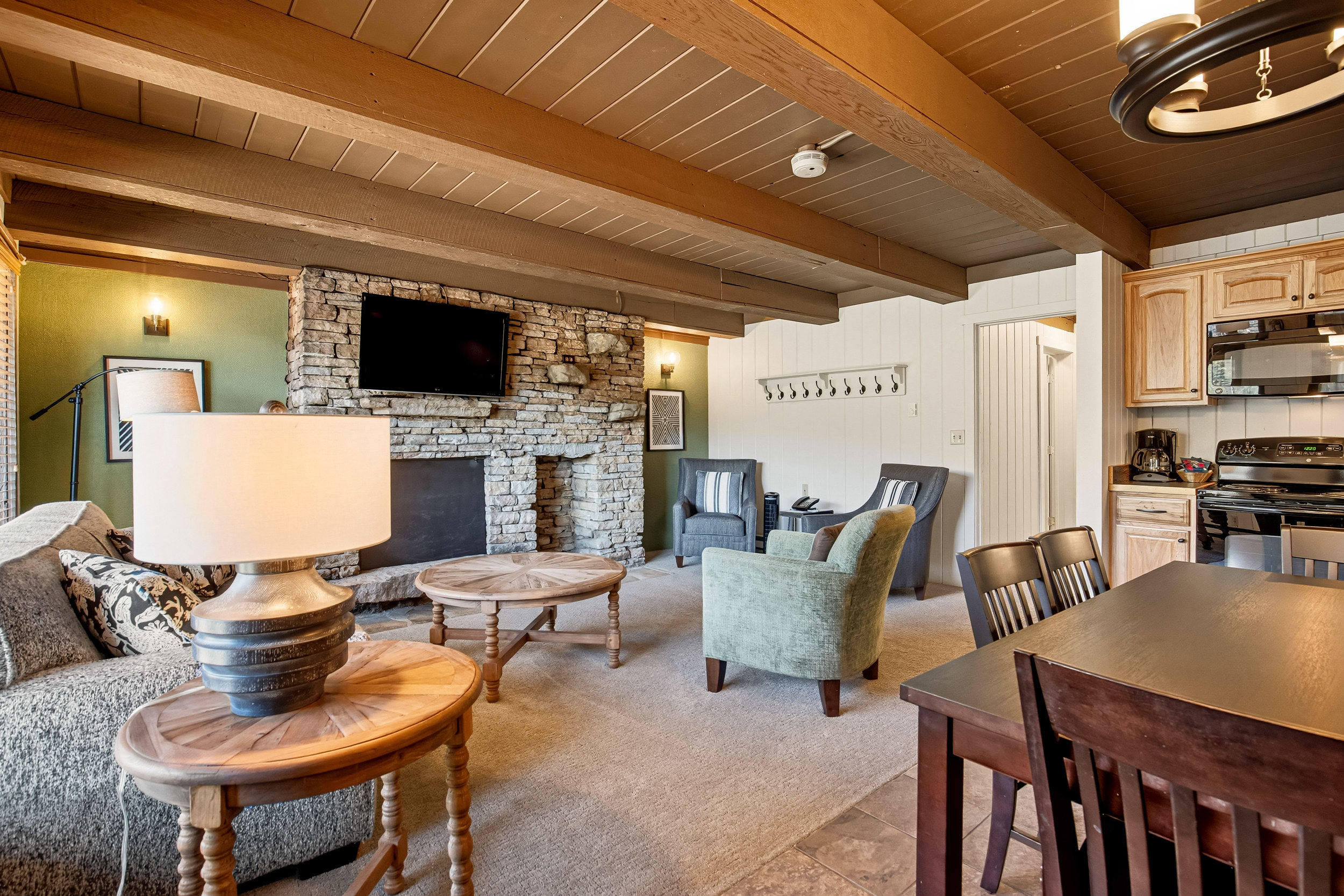 image The inviting living area combines cozy interiors with stylish decor, perfect for family gatherings after a day of exploration in the stunning mountain views.