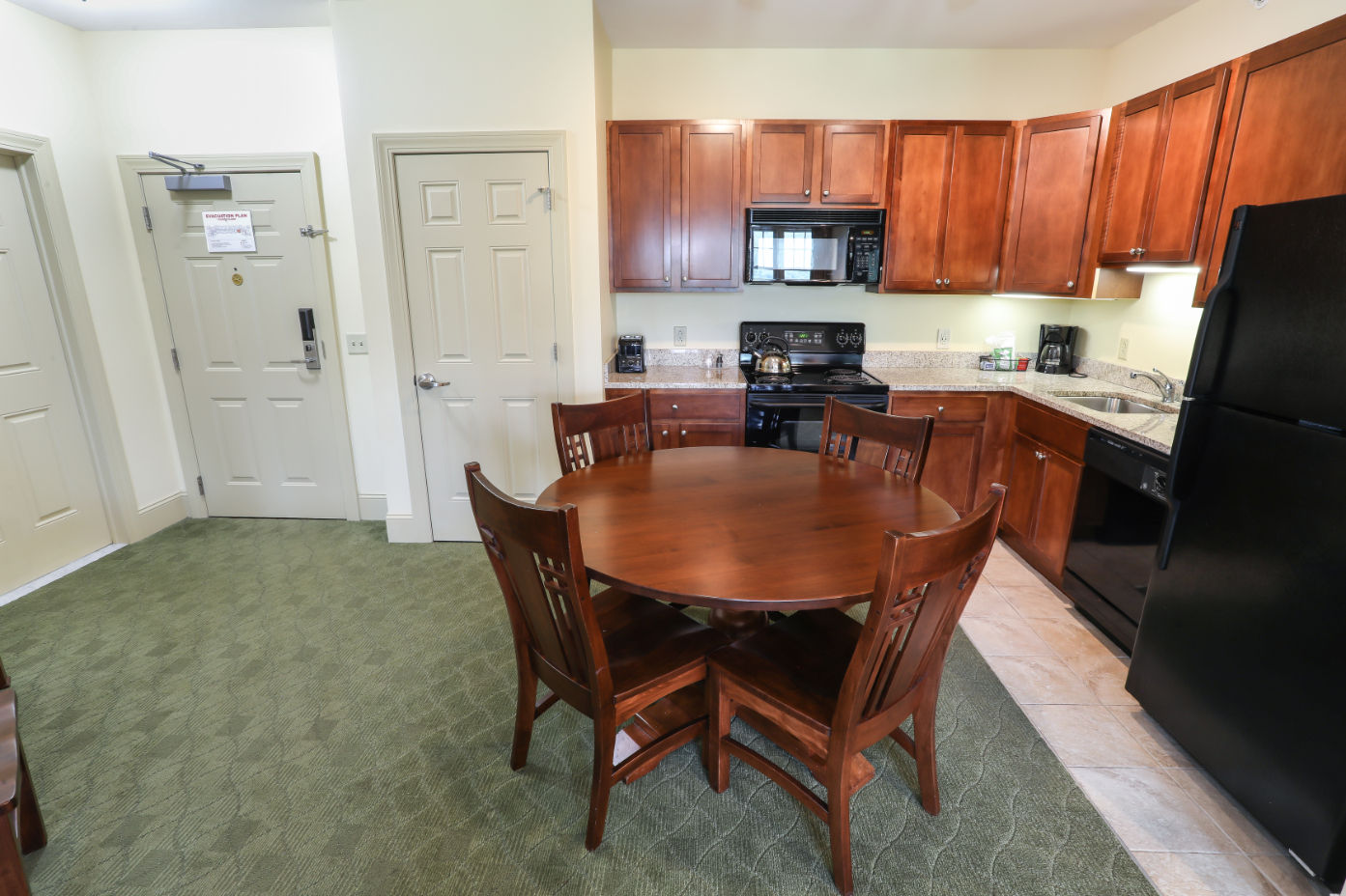 image Stylish kitchen with modern appliances and a cozy dining area, perfect for enjoying meals at home.