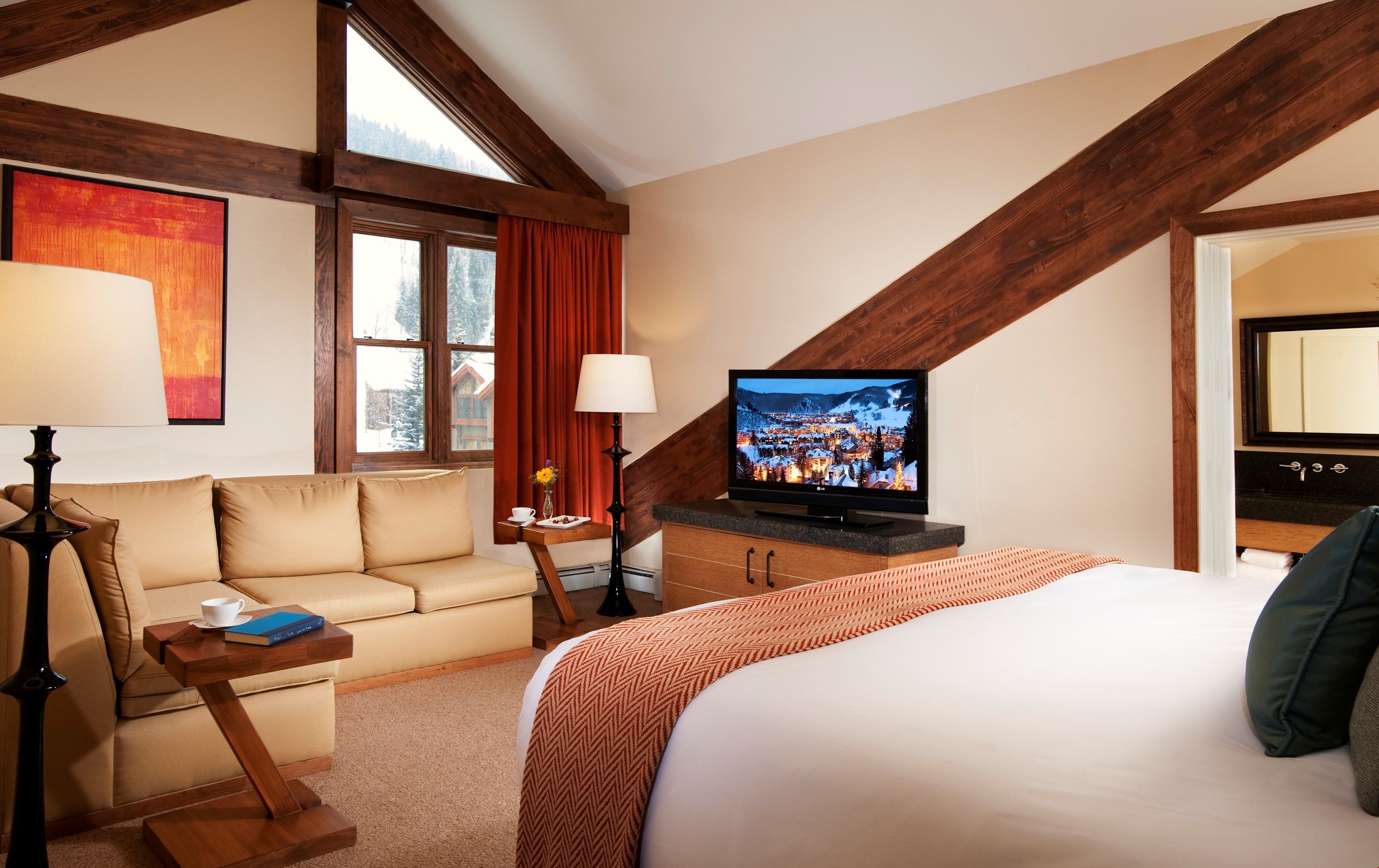 image Kick up your feet and relax in the cozy Deluxe Room.